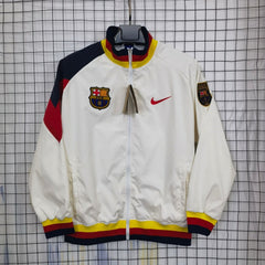 Barcelona White jacket with colorful accents and logos on a grid background