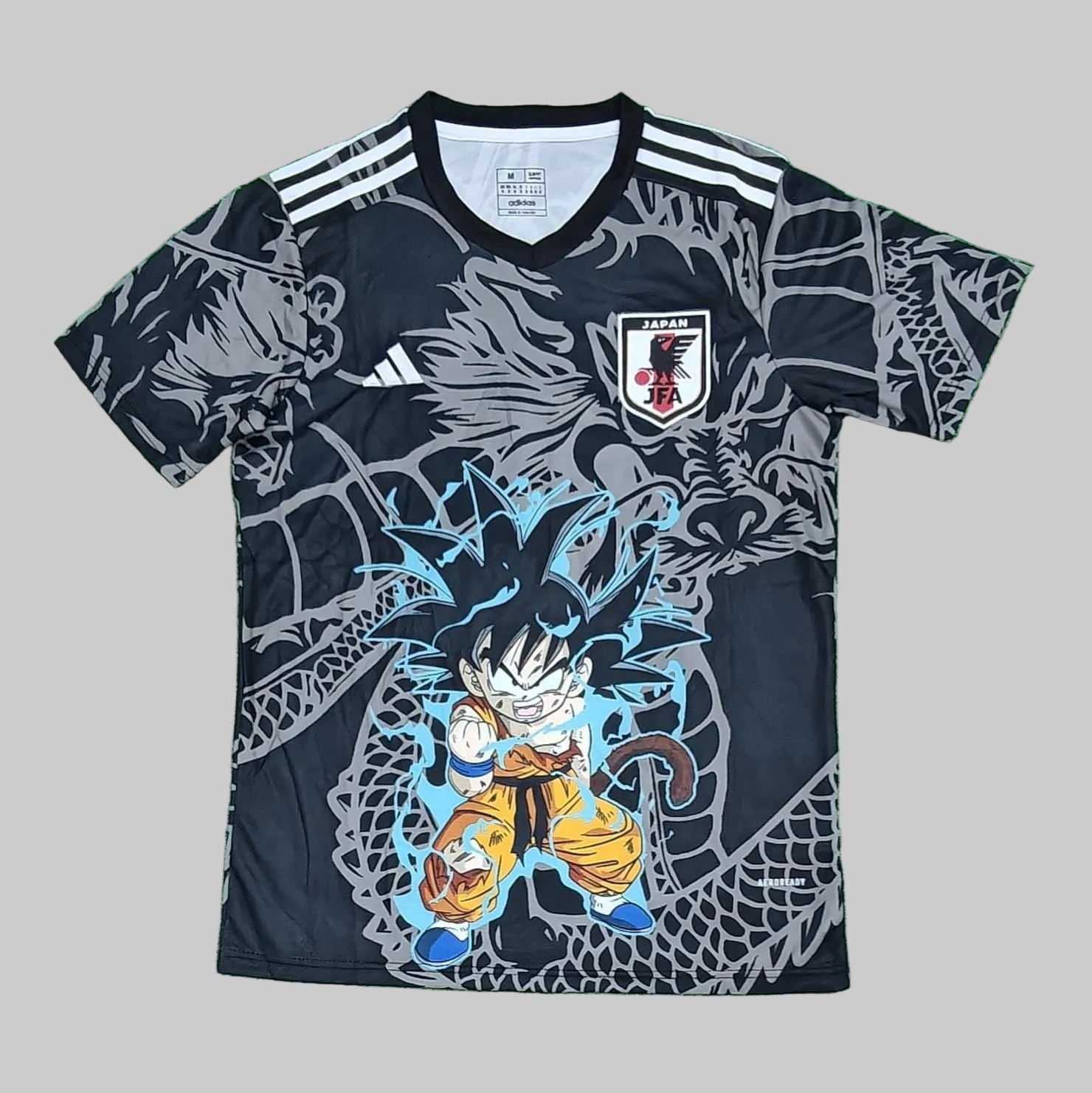 Soccer jersey with a dragon design on a green grass-like background