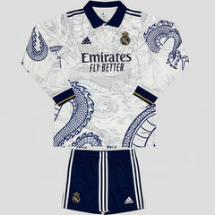 Real madrid jersey and shorts with dragon design on a white background