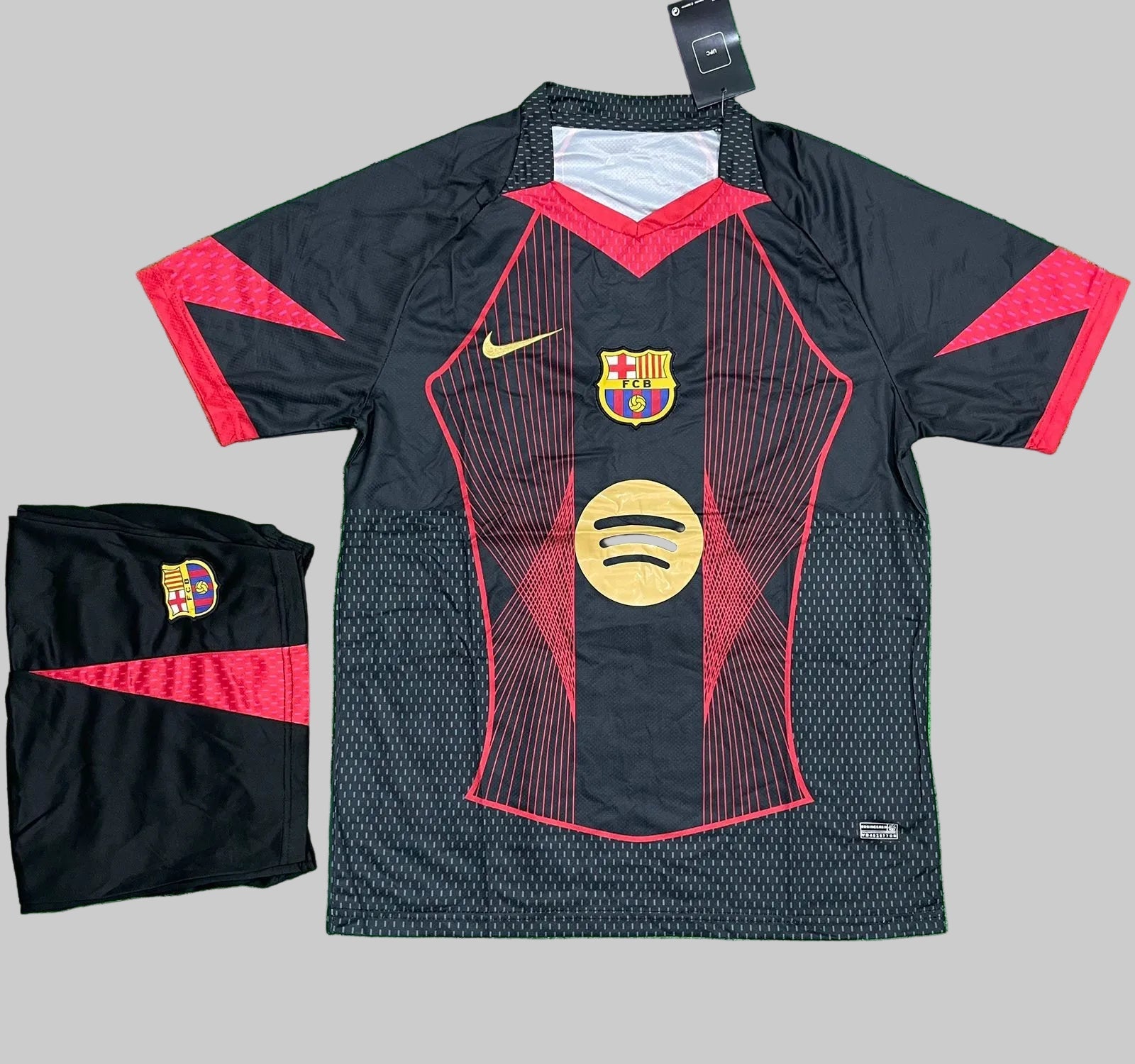 Barcelona sports jersey with red accents and visible branding on a green surface